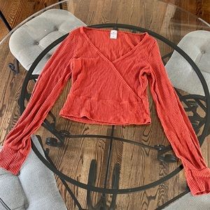 Orangish red color long sleeve shirt.